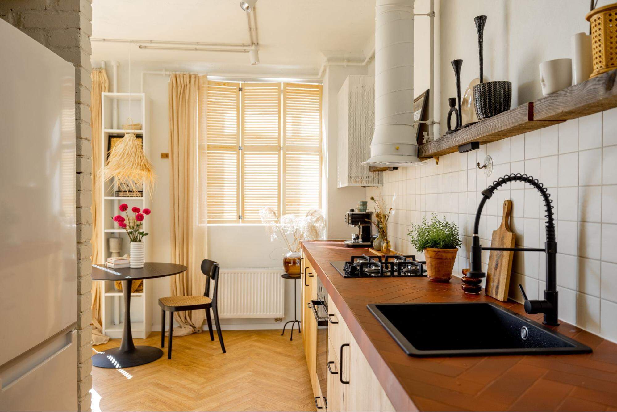 A Small Kitchen With A Dining Table 10