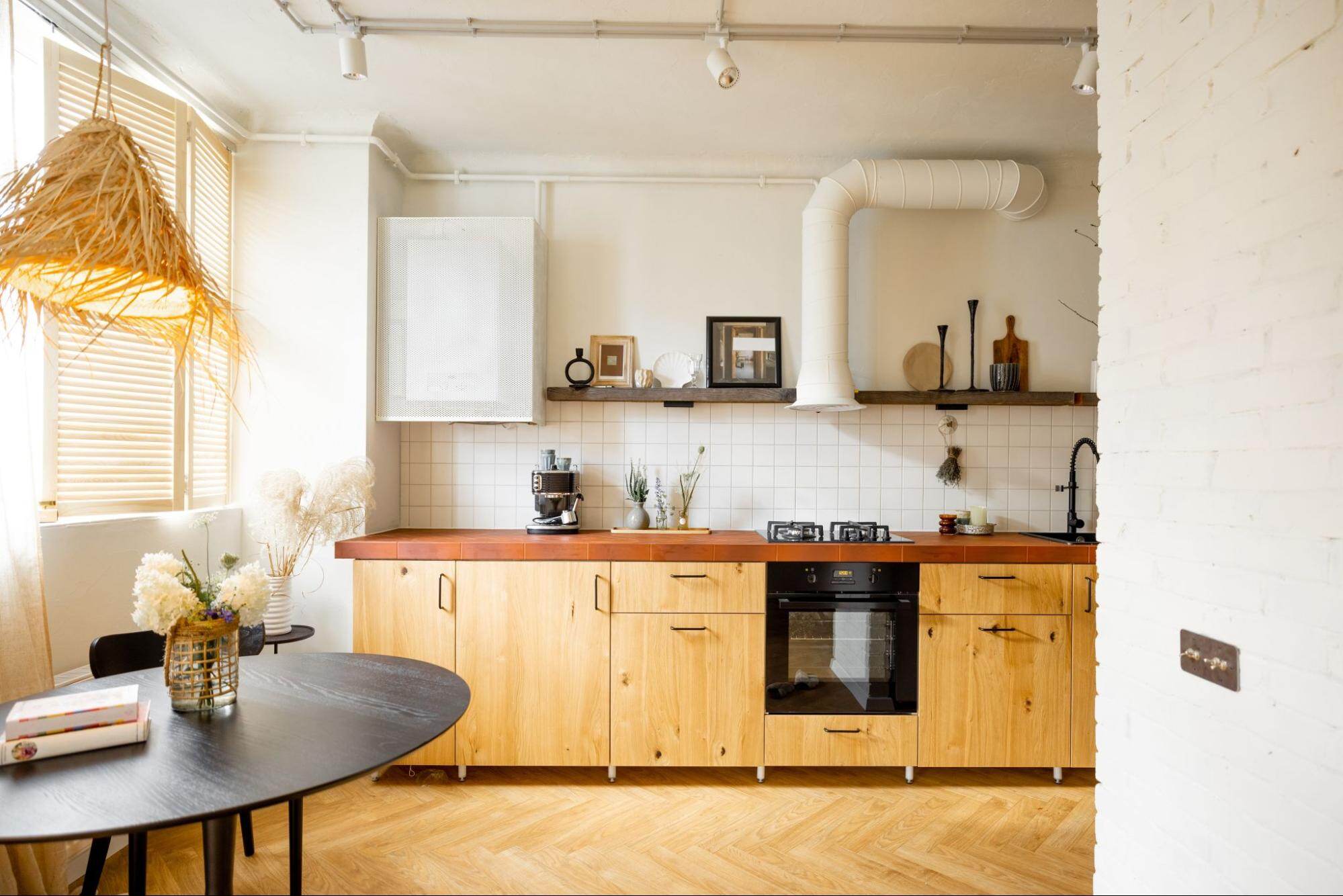 A Small Kitchen With A Dining Table 11