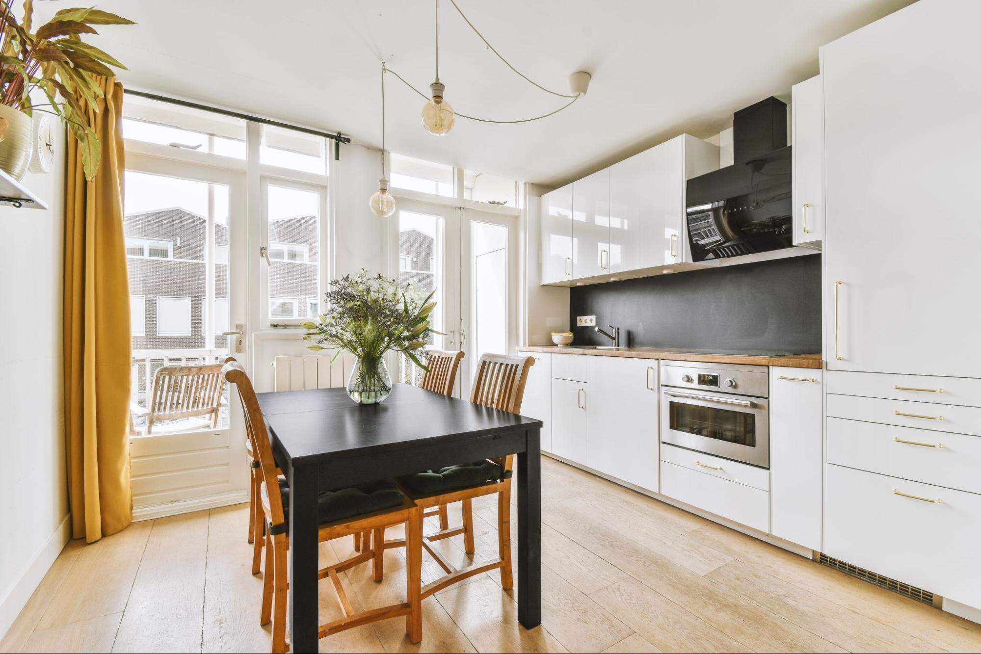 A Small Kitchen With A Dining Table 14