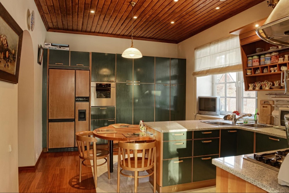 A Small Kitchen With A Dining Table 15