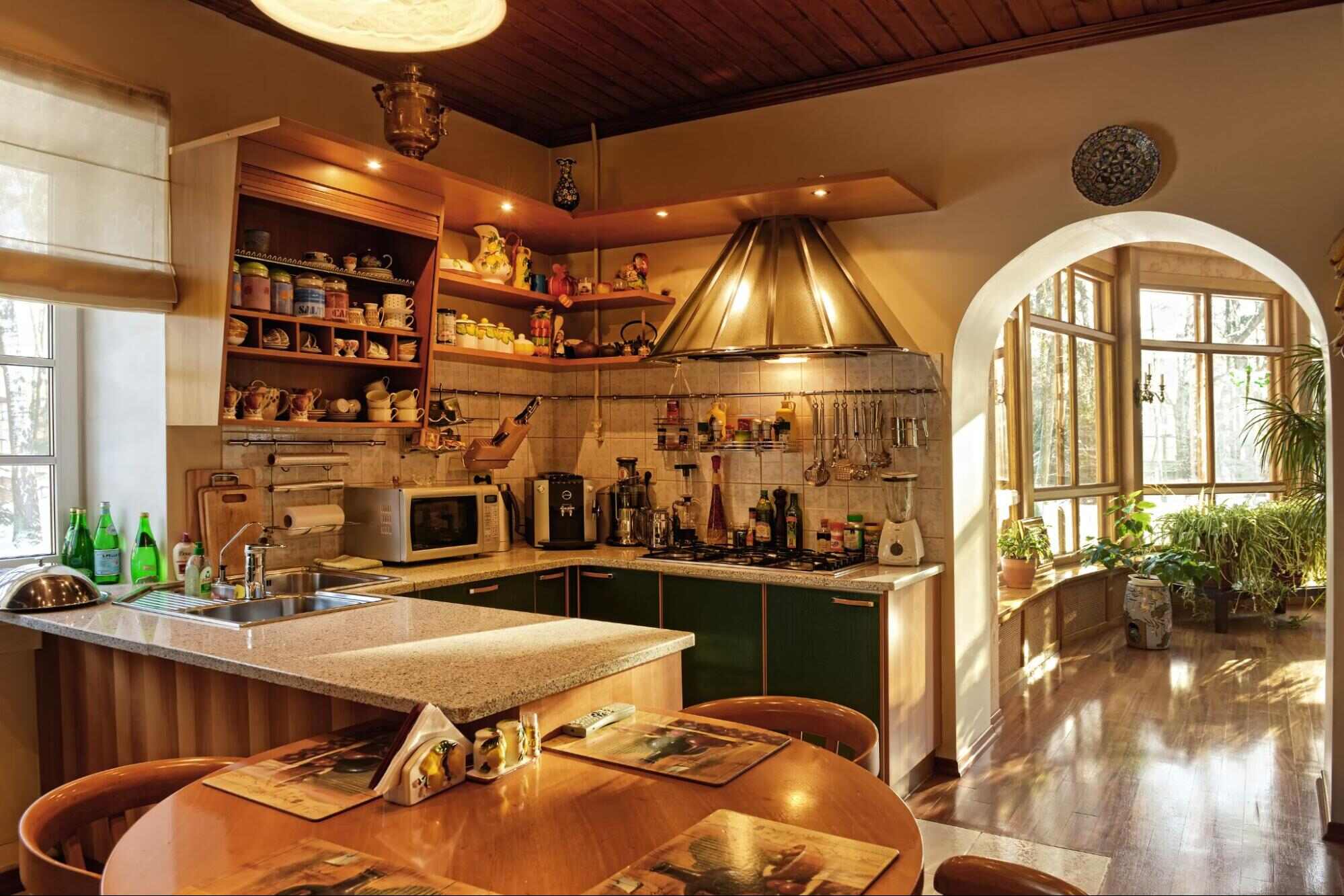 A Small Kitchen With A Dining Table 16