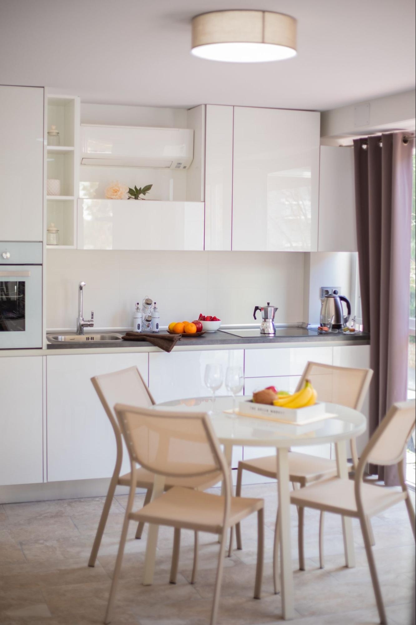 A Small Kitchen With A Dining Table 5