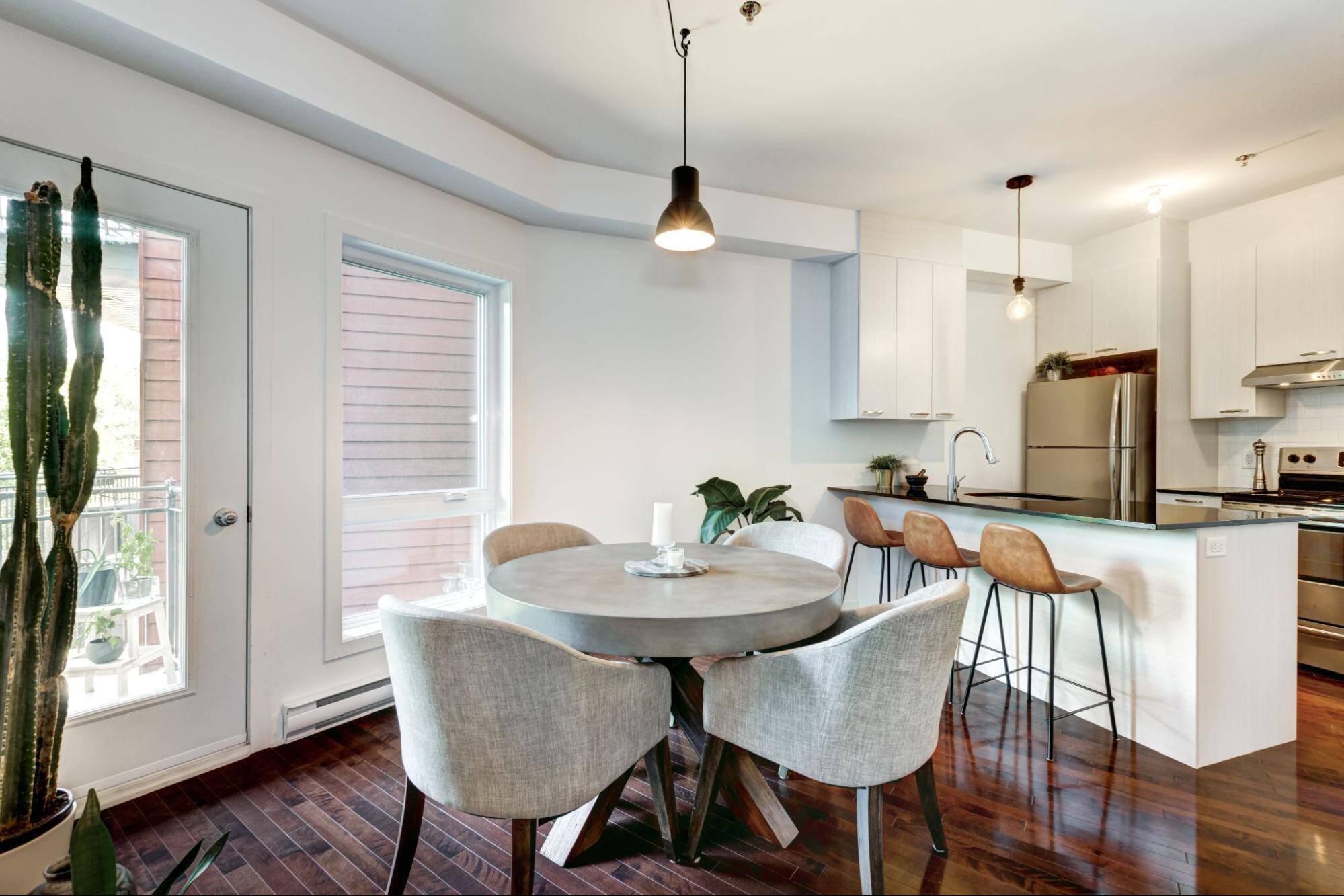 A Small Kitchen With A Dining Table 8