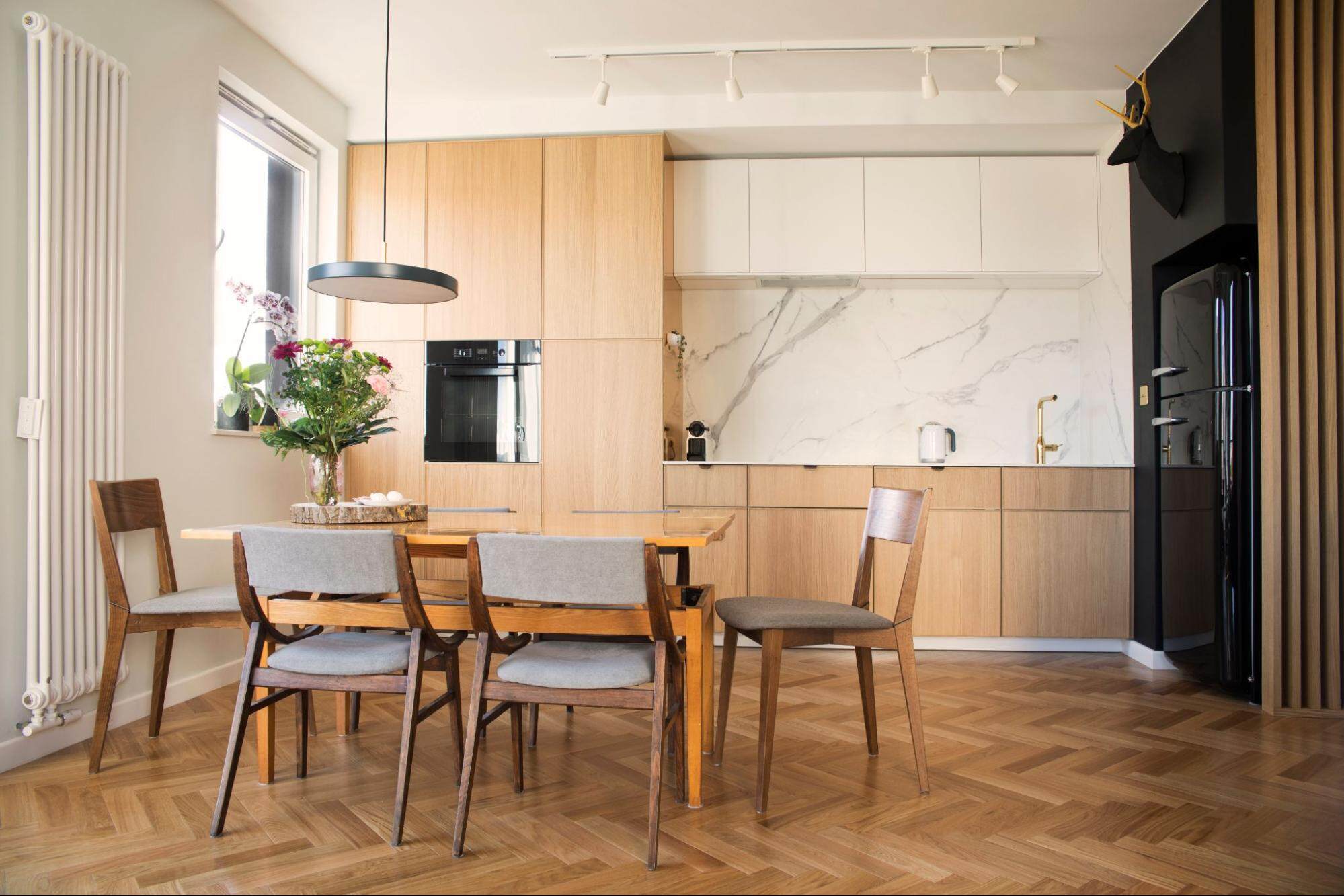 A Small Kitchen With A Dining Table 9